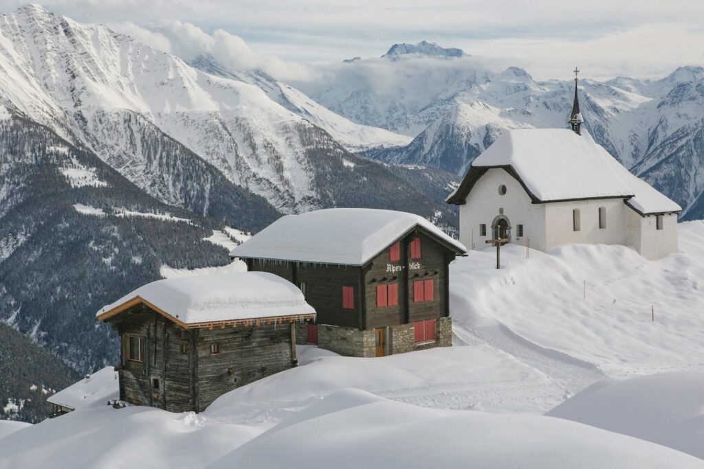 brown and black house on snow covered mountain